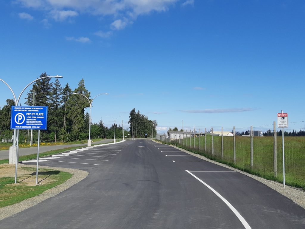 image of newly constructed paved and lined parking spots at Qualicum Beach airport