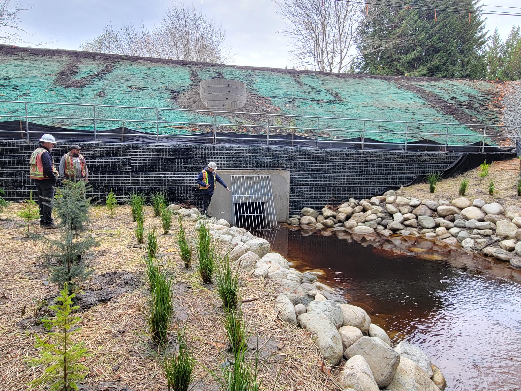 Crescent Road Culvert Repair showing workmen at mouth of culvert