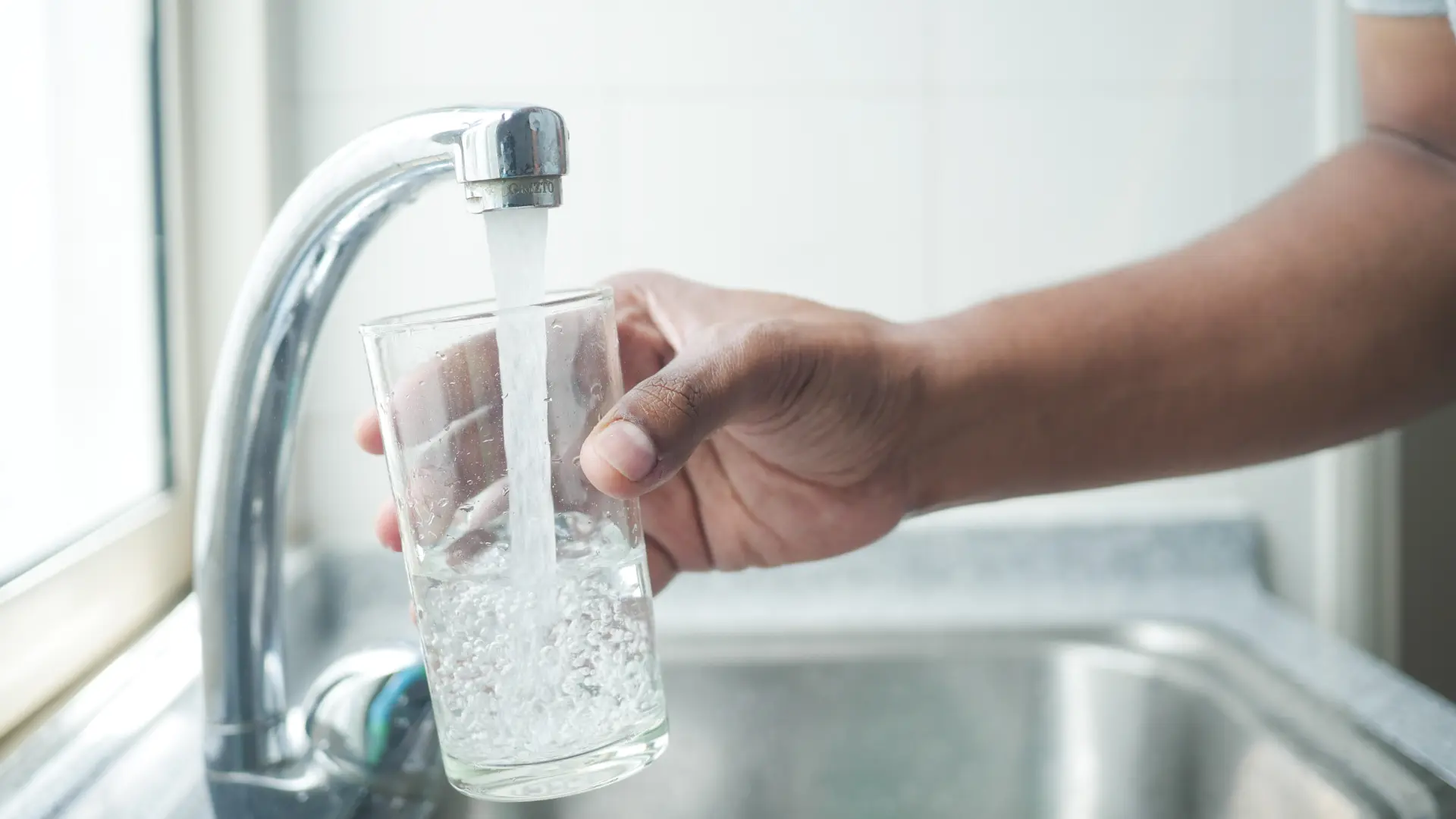 Clear tap water into a glass.