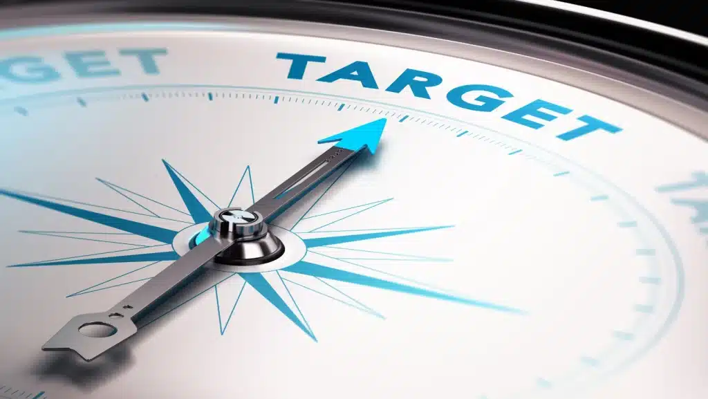 image of a compass with the needle pointing to the word "Target"